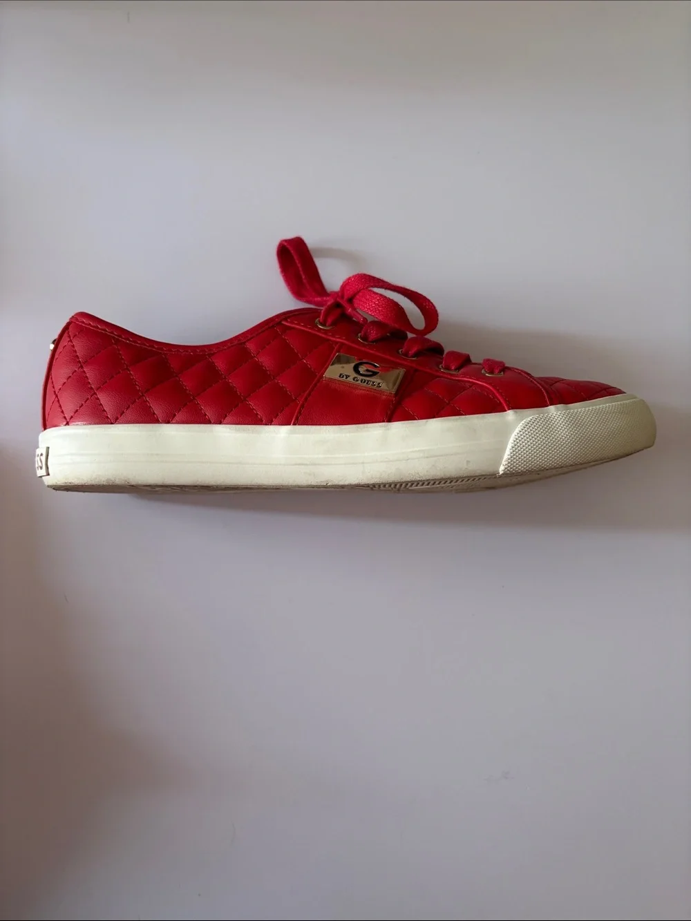 GUESS size 7.5 red quilted leather Sneakers with Gold Hardware very good shape